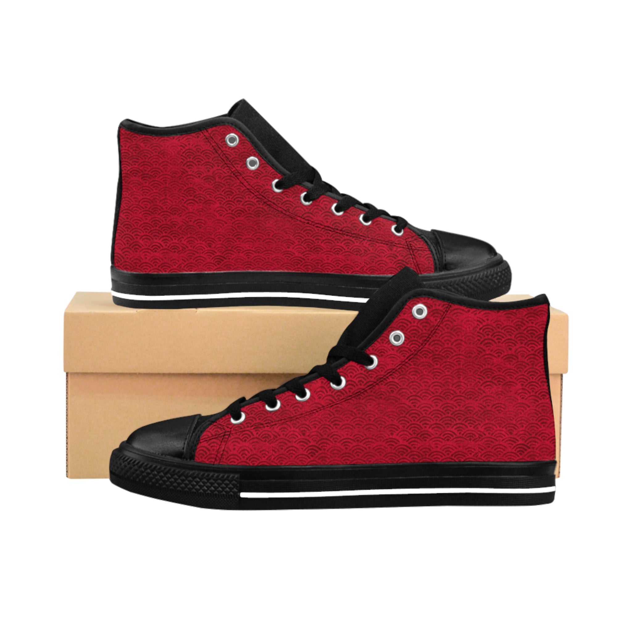 Side view of both Digby Golf high top canvas sneakers in red and black color featuring Japanese fan pattern, facing each other from opposing sides with one shoe above the other on a box.